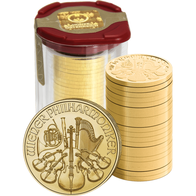 Münztube mit Wiener Philharmonikern in Gold, daneben ein Stapel Münzen und eine einzelne Münze