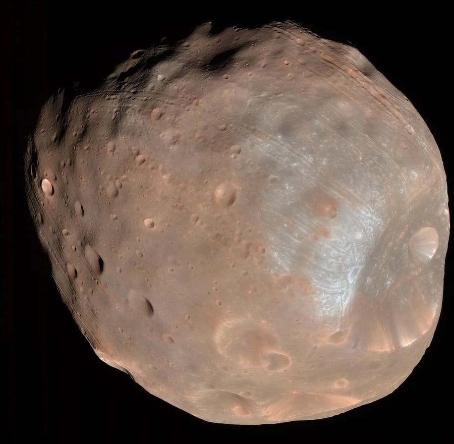 The Martian moon Phobos, irregular in shape, with craters and grooves